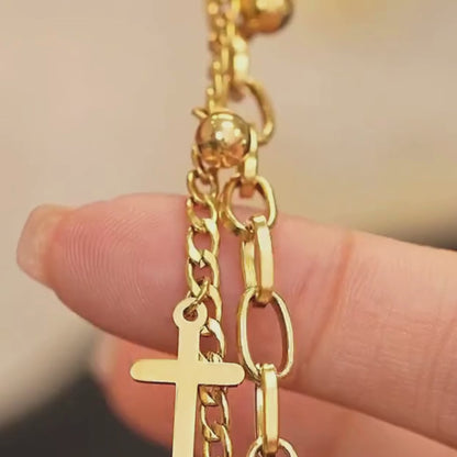 Armband mit mehrlagigem Kreuzanhänger